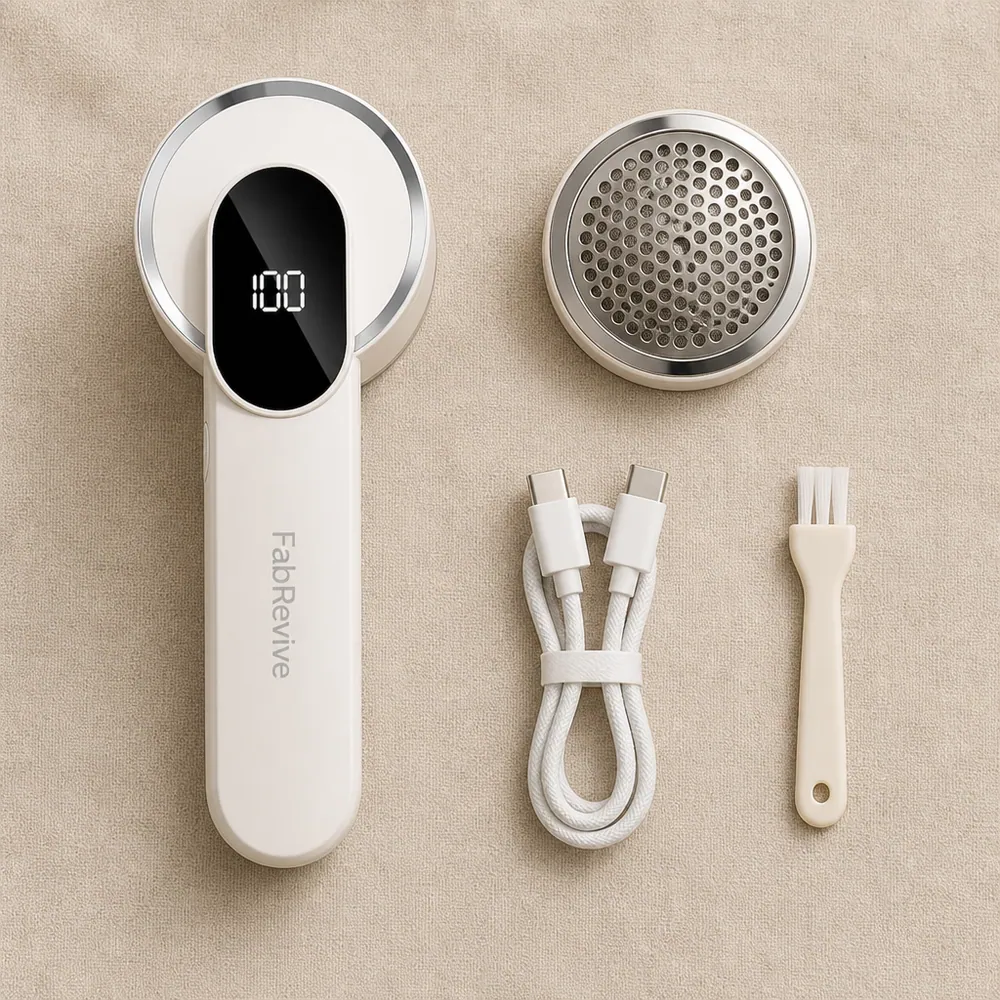 FabRevive shown from above with its charging cable and accessories